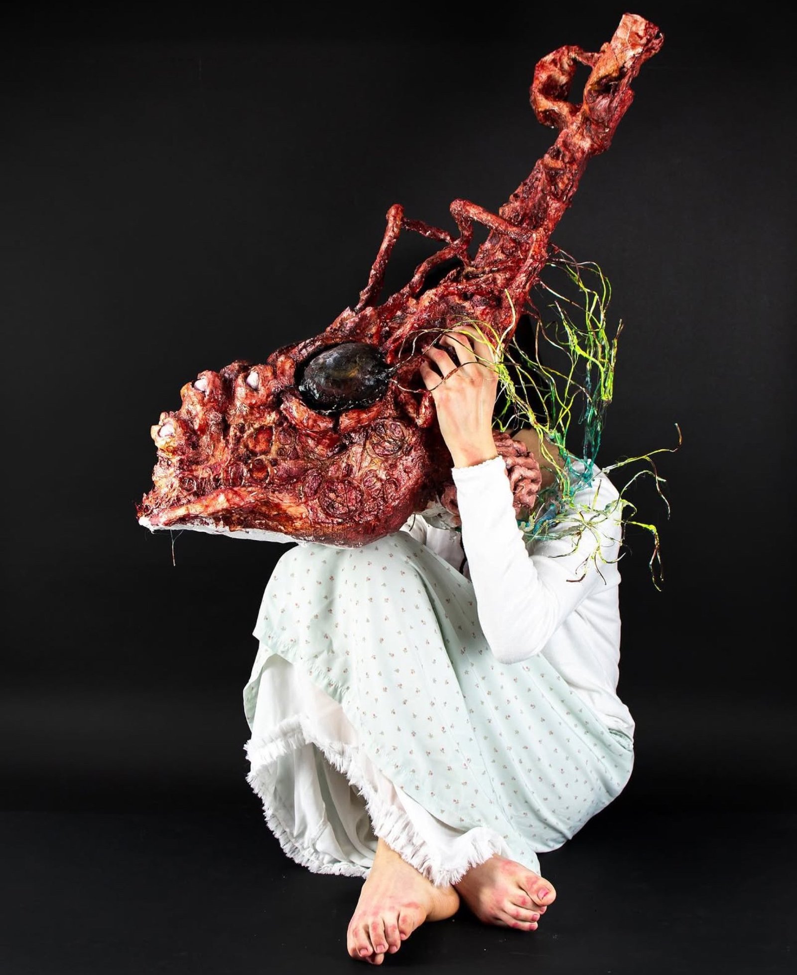 Person wearing a sculptural headpiece